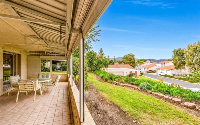 Large covered patio runs the length of the home and offers peaceful neighborhood views.