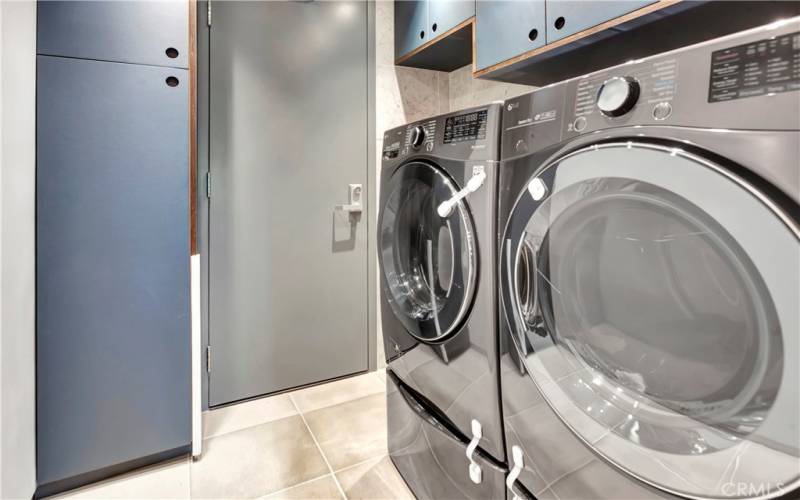 Laundry room with built in cabinets.