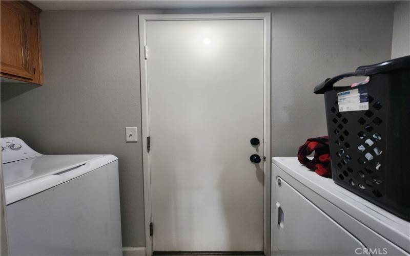 Downstairs Laundry Room located between Kitchen and Garage