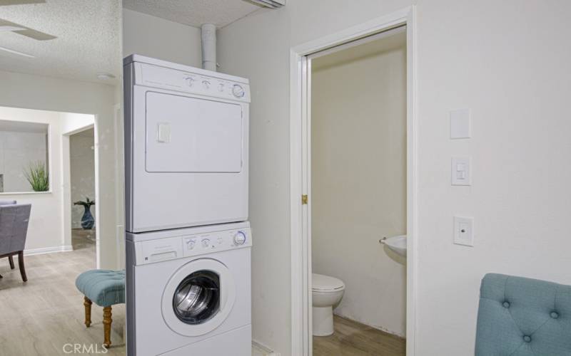 Stackable washer-dryer unit in the guest bedroom closet.