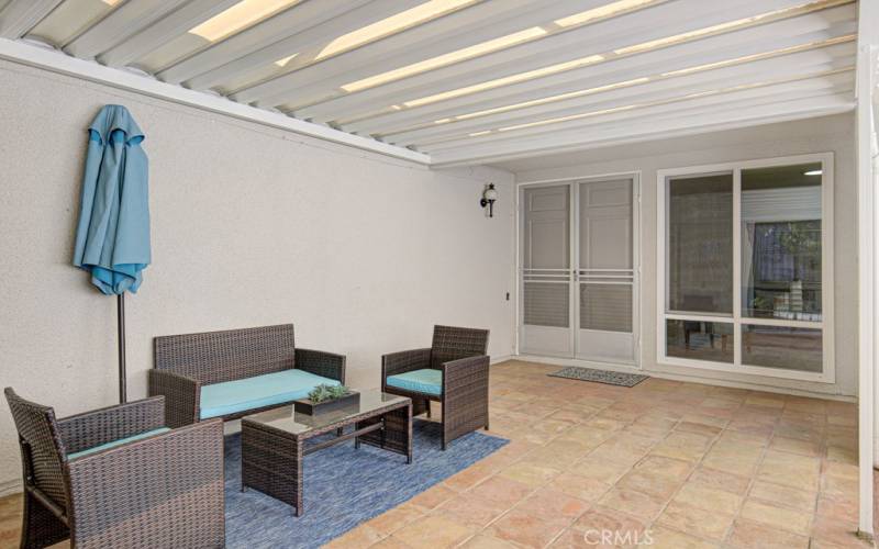 Large private covered patio is ideal for year-round outdoor entertaining, dining and relaxing.