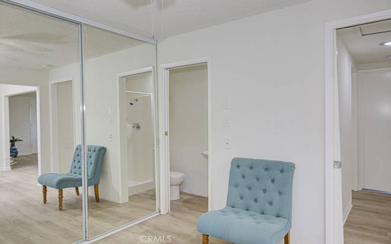 Guest bedroom has an attached 3/4 bathroom. There is a stackable washer-dryer inside the guest bedroom closet.