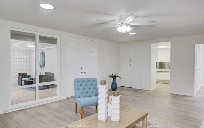 Another view of the living room. Entry to kitchen at right.