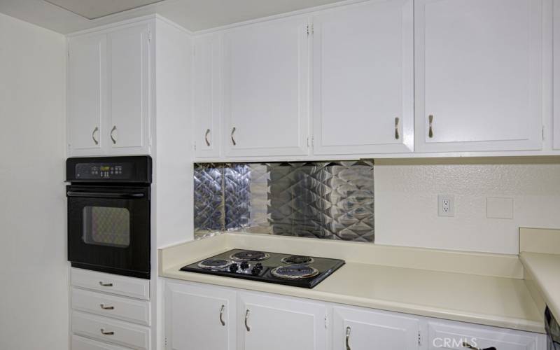 Kitchen features lots of cabinet storage.