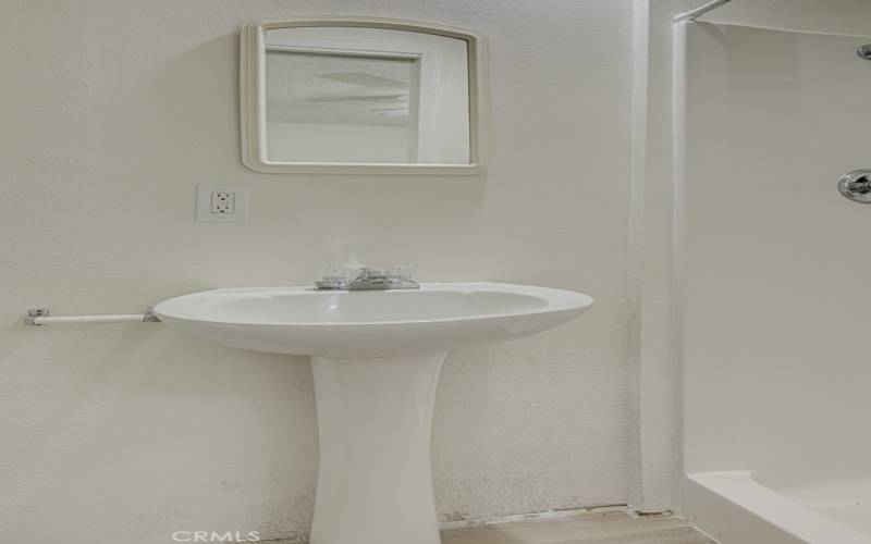 Pedestal sink in guest bathroom.