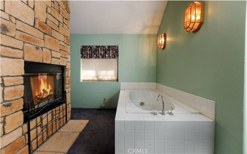 Primary Bedroom Romantic Fireplace with Jetted tub.