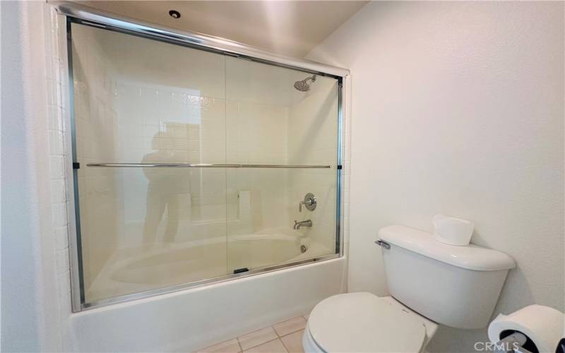 Primary bathroom with tub and shower