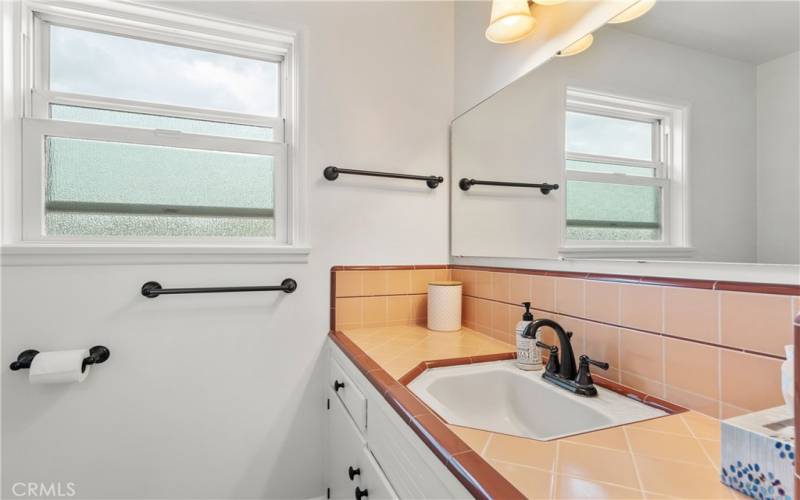 Bathroom and dressing area and sink double sink.