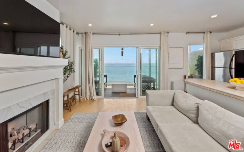 Main Living Area | Decorative Fireplace | Ocean Front Balcony