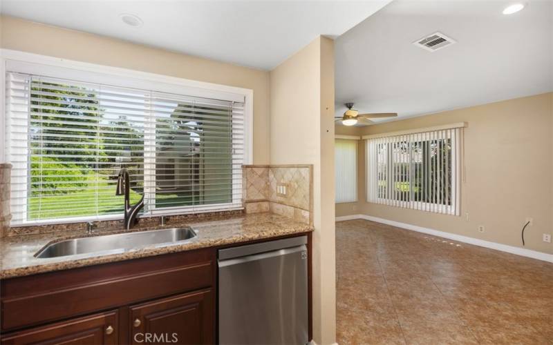 Updated kitchen with window looking towards greenbelt