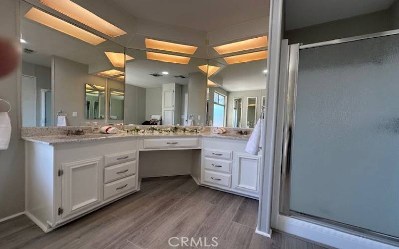 Master bathroom with two sinks and shower.