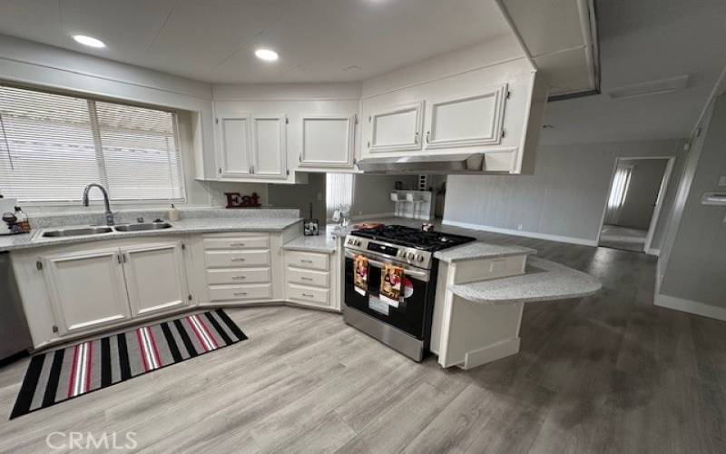 Kitchen with wet bar in the background.