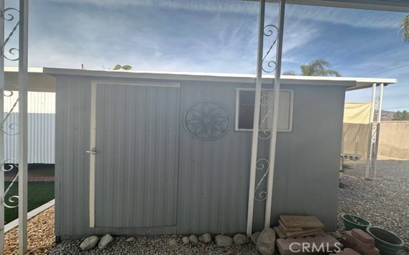 Aluminum walk- in shed.