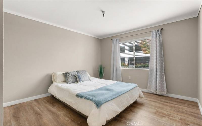 Bedroom with window to greenbelt.