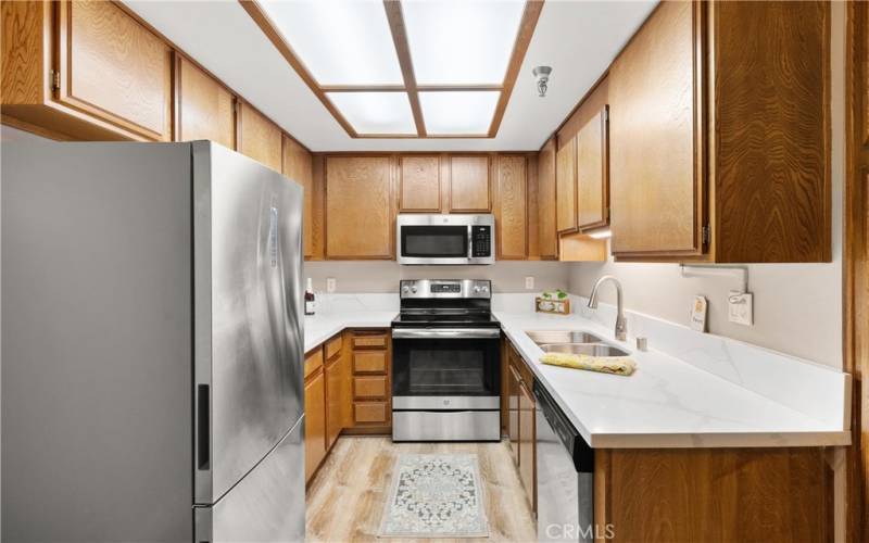 Stainless appliances and quartz counters.