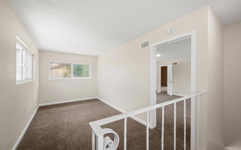 Upstairs has room/office and primary with walk in closet and bath