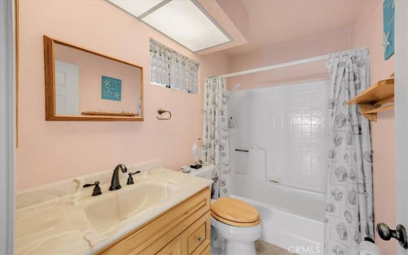 Guest bathroom with tub/shower.