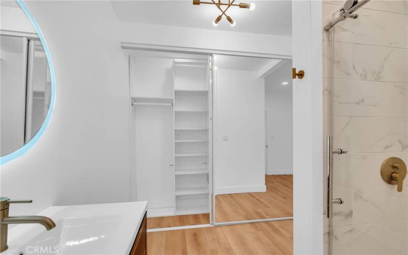 Oversized floor to ceiling master closet with built ins