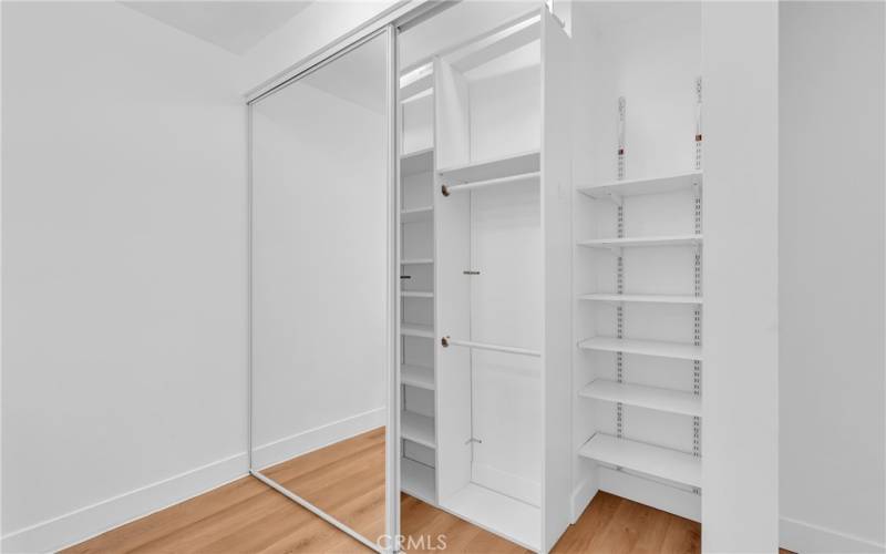 Oversized floor to ceiling master closet with built ins