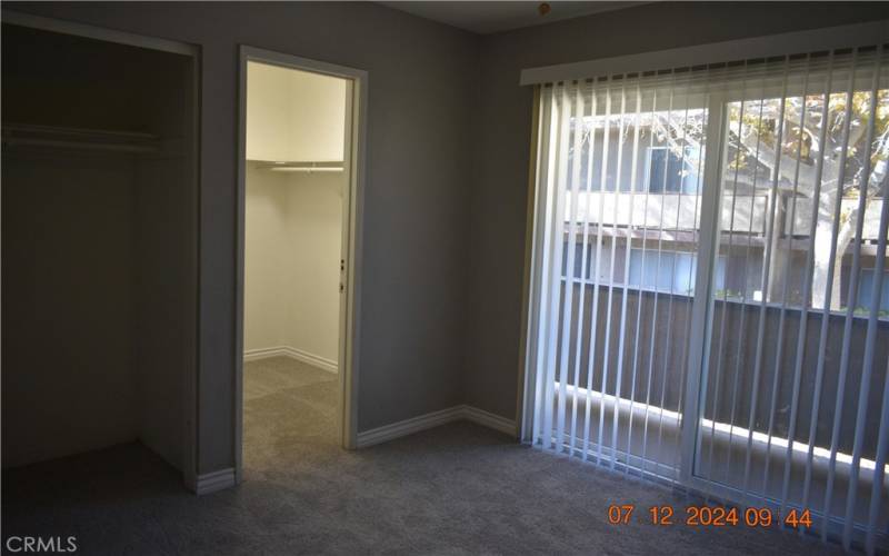 master bedroom with walk in closet