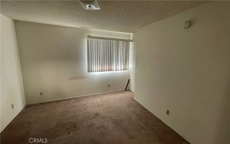 Second floor bedroom looking out second closet and window.