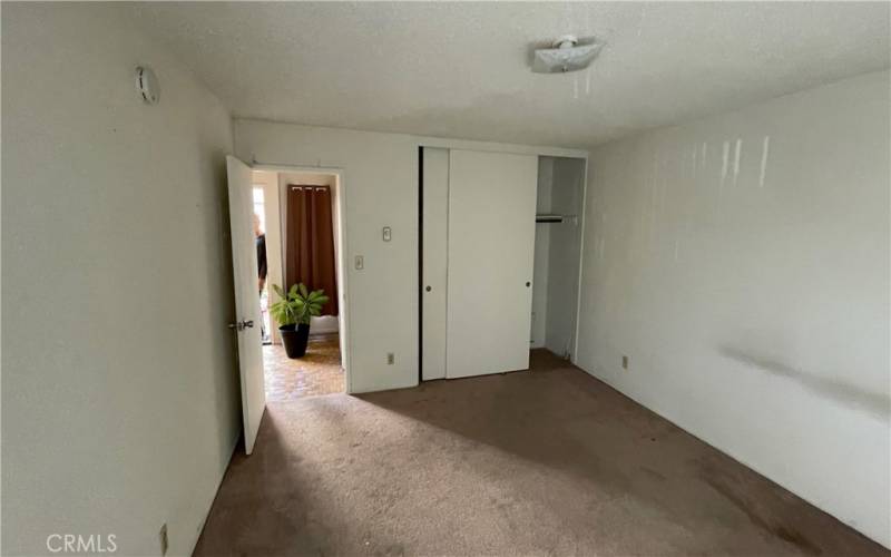 Second  floor bedroom looking out closet .