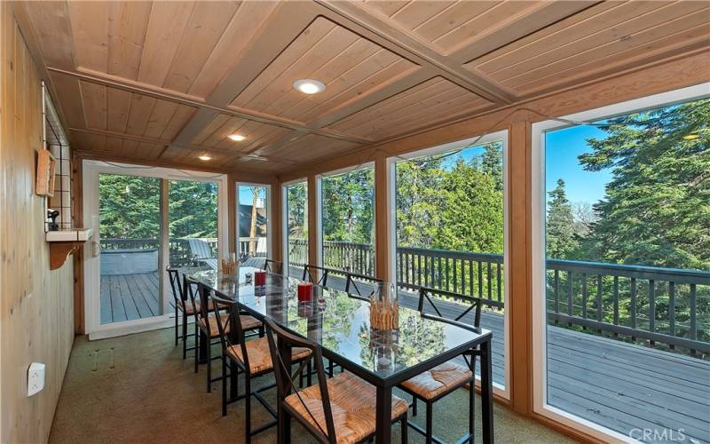 Dining Room With Treed Views And Main Deck Access