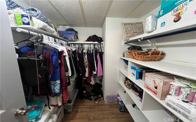 Walk in closet in primary bedroom