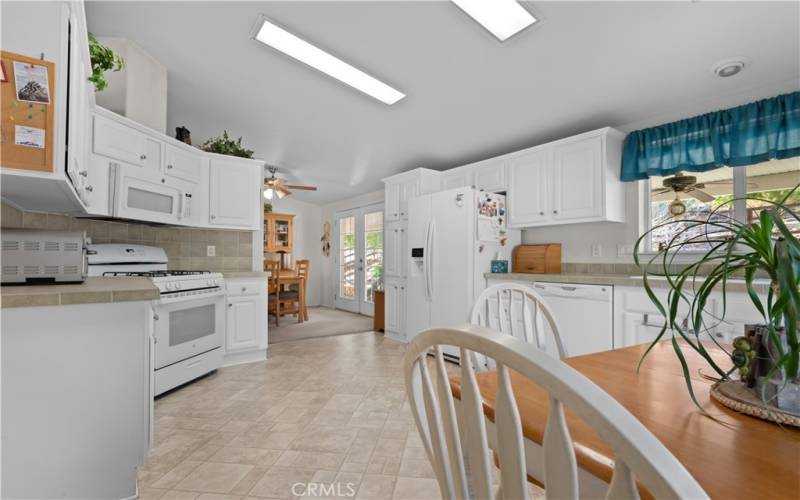 Main home kitchen looking into the dining room. All major appliances stay with home.