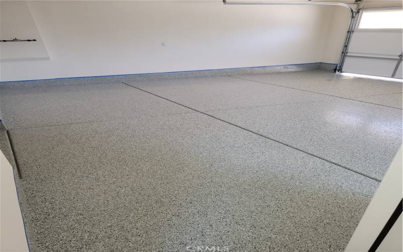 oversized 2 car garage with epoxy flooring