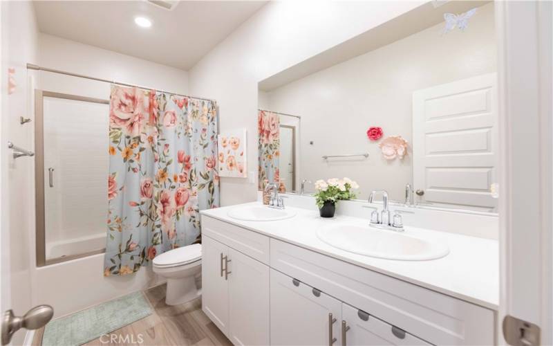 upstairs bathroom with upgraded enclosed shower