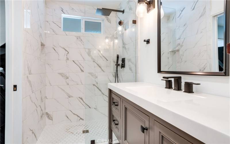 Primary En suite with gorgeous tile and vanity