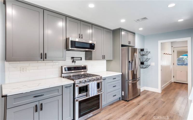 New Cabinets with Quartz Countertops and Subway Tile.