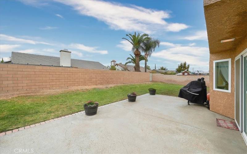 Very large back yard with nice block walls.