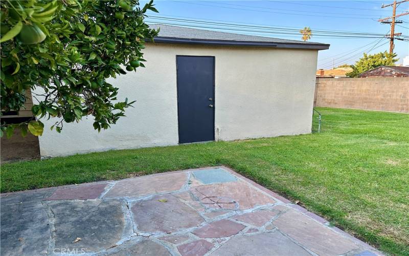 Two car, separate garage opens to alley.