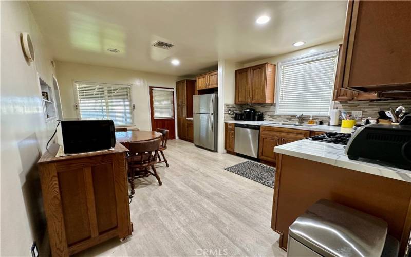 Bright and fully equipped with stainless steel appliances.