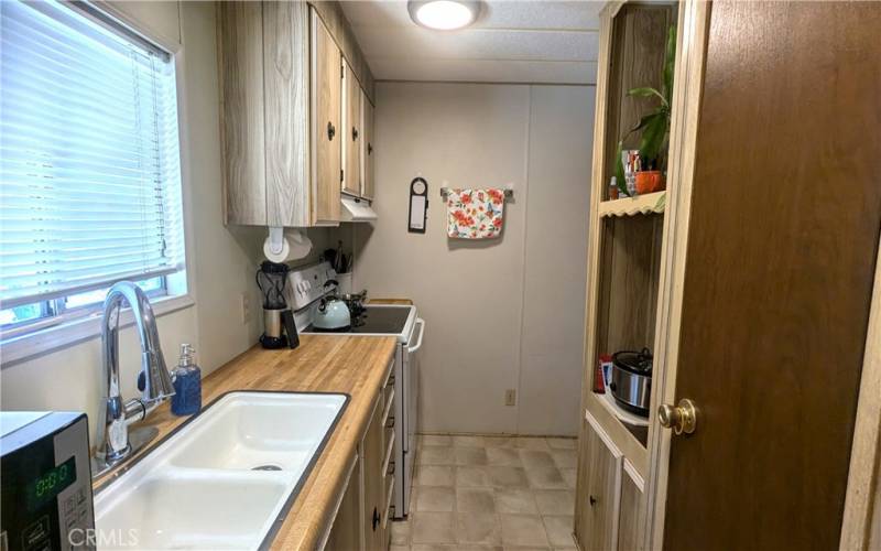 Kitchen has a built-in hutch and pantry