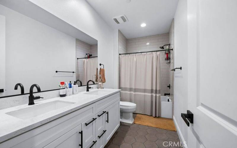 Front of house bathroom also with double sinks