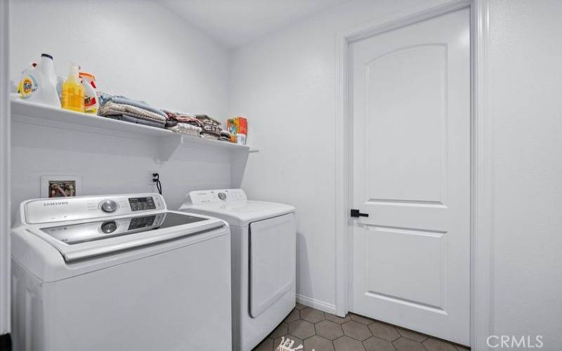 Laundry room connected to mud room off massive garage