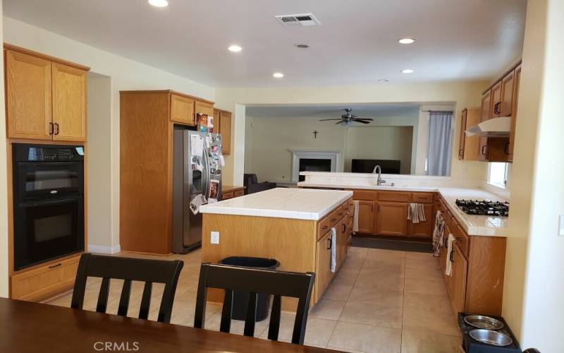 View kitchen with family room