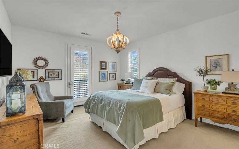 Primary bedroom with a balcony