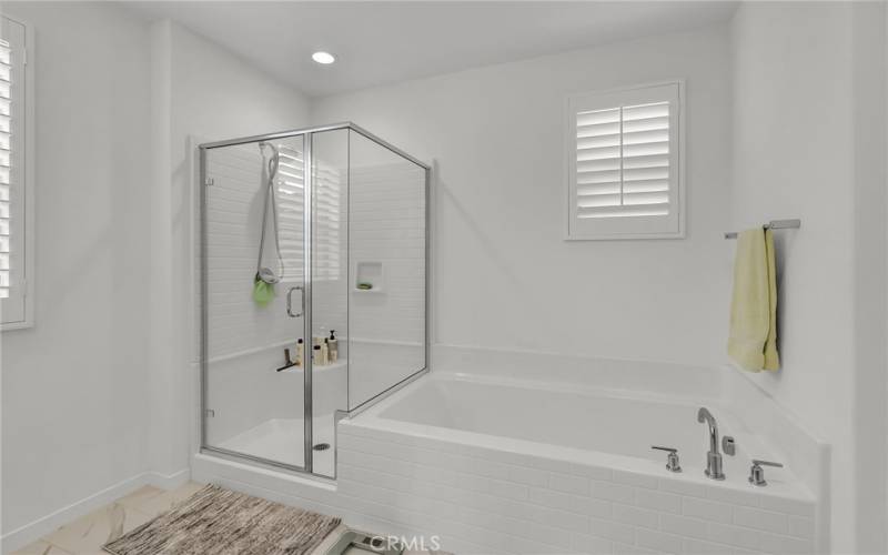 separate shower and tub in primary bathroom