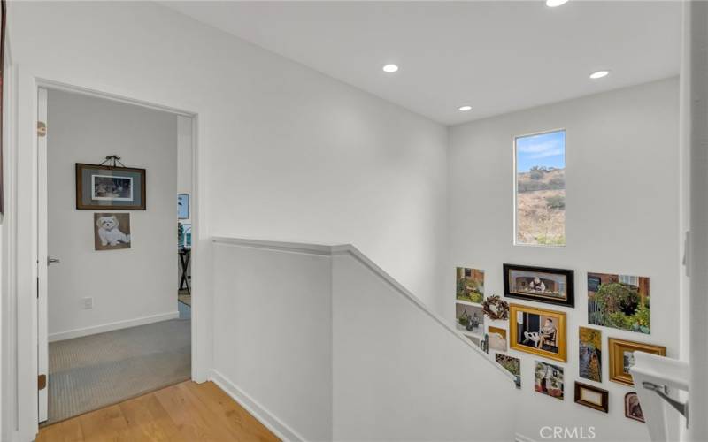 upstairs landing with natural light coming in from the window