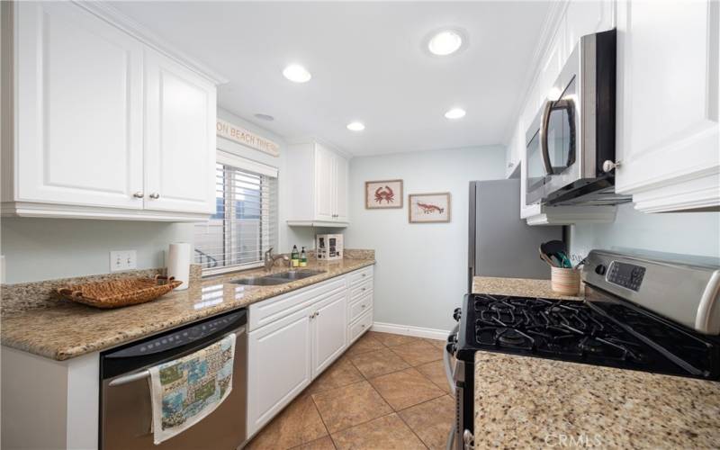 Galley kitchen with granite countertops