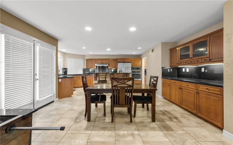 Eating area open to kitchen and buffet.