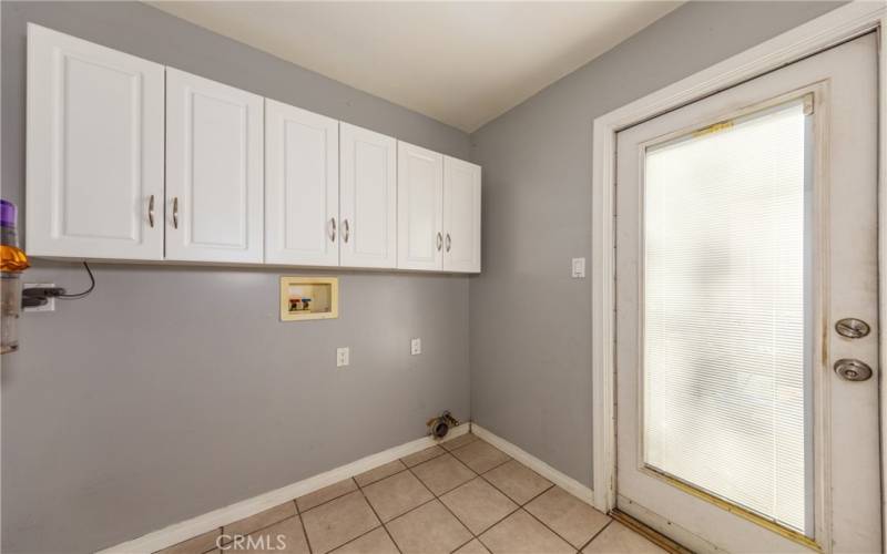 Laundry room with rear yard access