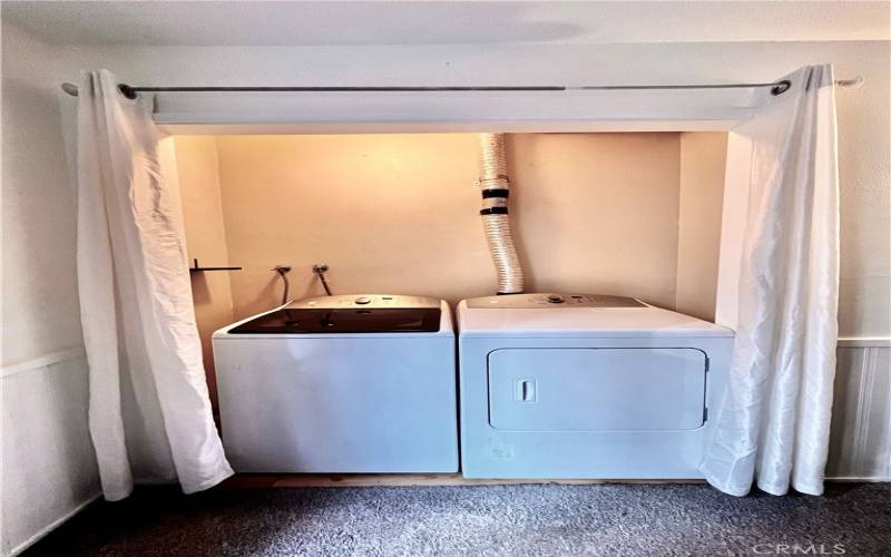 The washer and dryer are included, and conveniently located in an alcove within the primary bedroom.