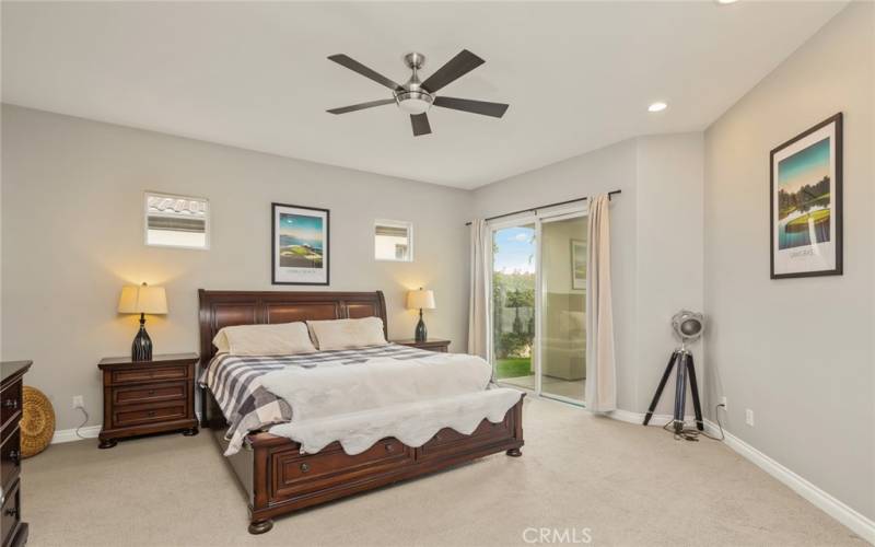 Main bedroom with Slider to Rear of Home and Course Views.