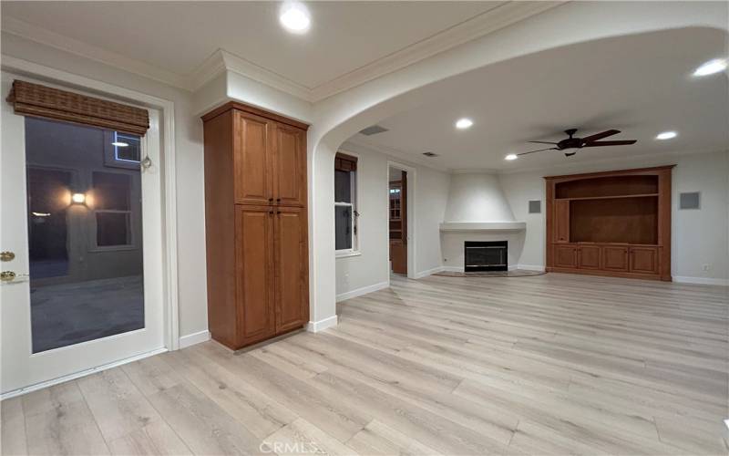 Nook and entrance to courtyard, Family Room with built in cabinets and four in wall surround sound speakers.