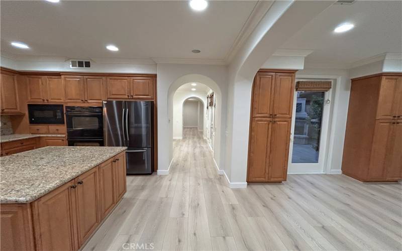 Kitchen, nook, and hallway to dining and living room